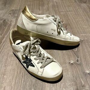 Golden Goose White Sneakers with Gold and Black Accents